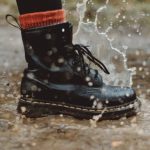 Waterproof - Water Splashing From A Person In Black Workers Boots Stepping On Wet Pavement