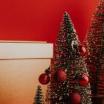 Experience Gifts - Small christmas trees and boxes on a red background