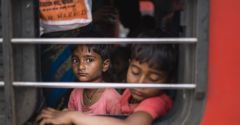 Sleep Aids - Two children look out of a train window