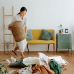 Kids' Clothing - Mother and Daughter Playing while Cleaning Up Clothes
