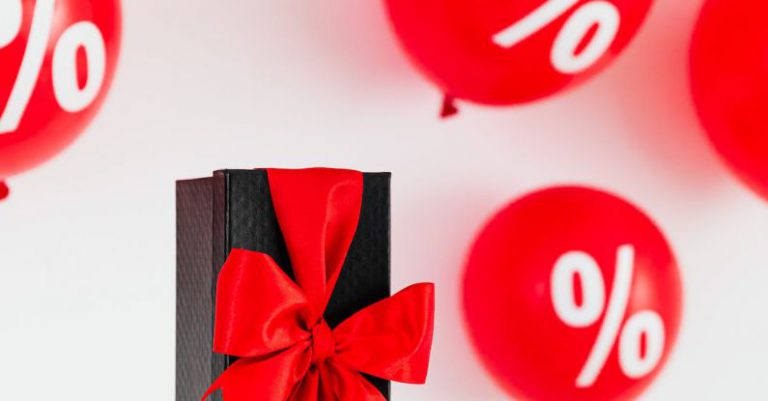 Discounts - Present With Balloons On The Background